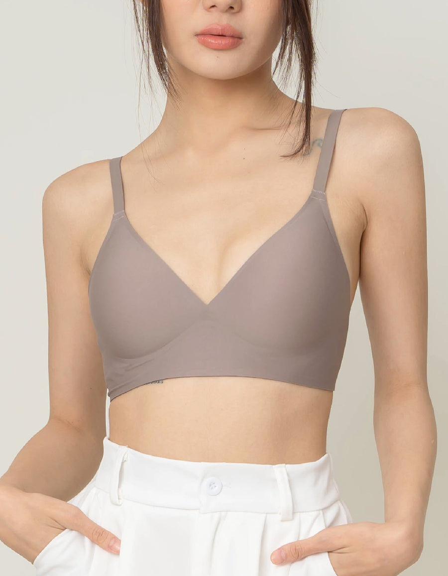 Chantelle's Secret Tri-Cup Daily Seamless Bra in a versatile taupe shade, featuring a soft v-neckline and slender straps for everyday elegance.