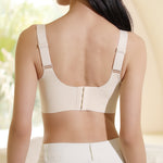 Back view of a model wearing Chantelle's Secret Seamless Skin-Toned Bra with adjustable straps and a secure hook-and-eye closure for a smooth, supportive fit.